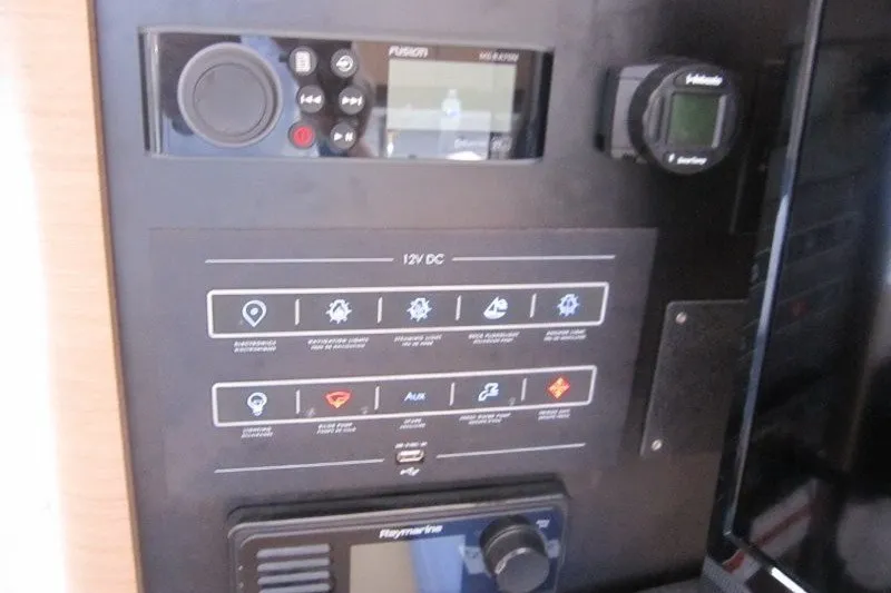 Slide: The Image of Control panel of 2024 Jeanneau Sun Odyssey 380 yacht with navigation and audio systems. - 25