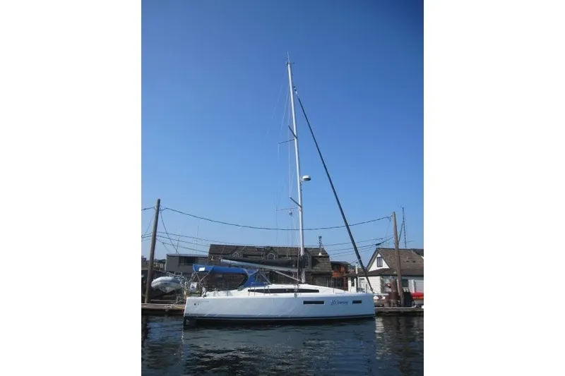 Slide: The Image of 2024 Jeanneau Sun Odyssey 380 sailboat docked under clear blue sky. - 28