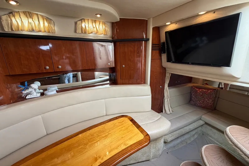 Slide: The Image of Luxurious interior of 2006 Sea Ray Sundancer 320 yacht with plush seating and TV. - 85