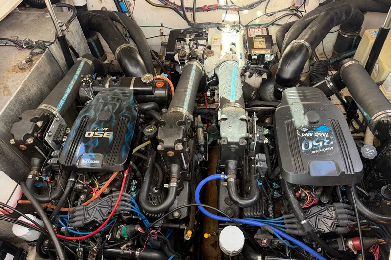 Slide: The Image of Engine compartment of a 2006 Sea Ray Sundancer 320 with twin MerCruiser 350 MAG MPI engines. - 99