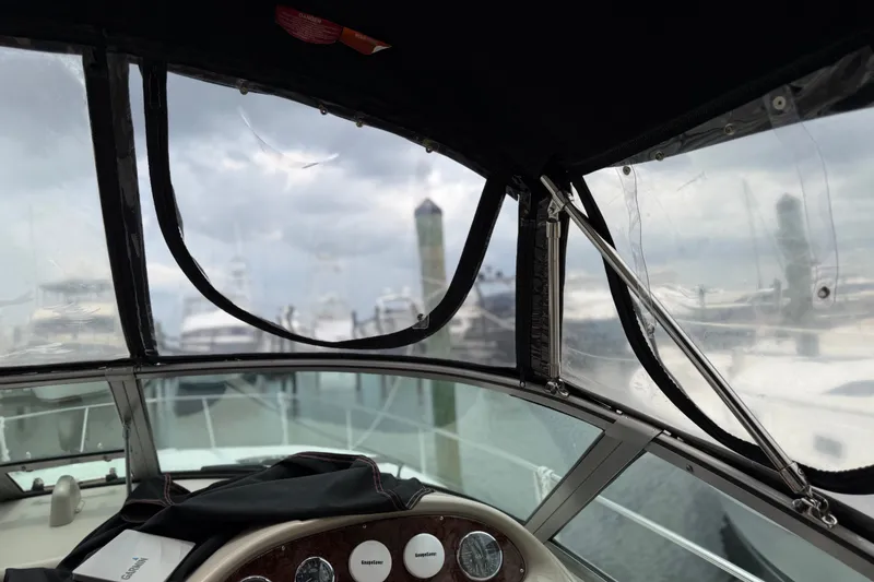 Slide: The Image of Interior view of 2006 Sea Ray Sundancer 320 boat with marina background. - 7