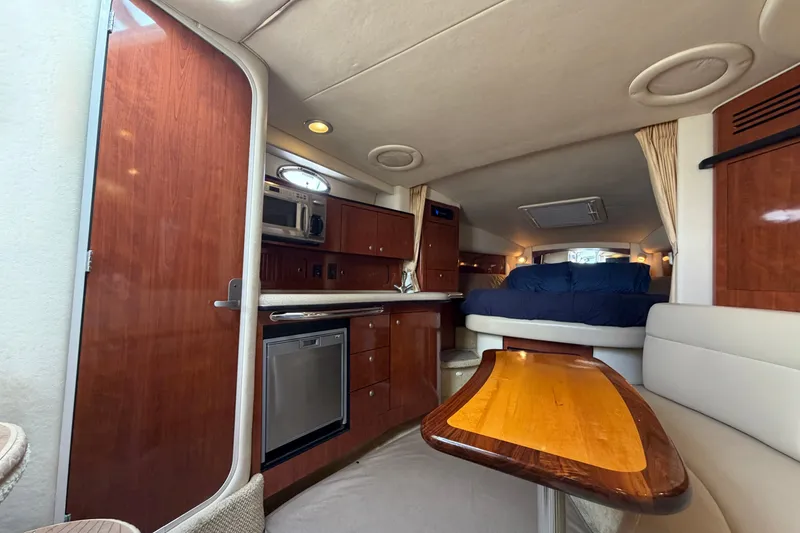Slide: The Image of Interior of 2006 Sea Ray Sundancer 320 yacht with wood cabinetry and cozy seating area. - 66