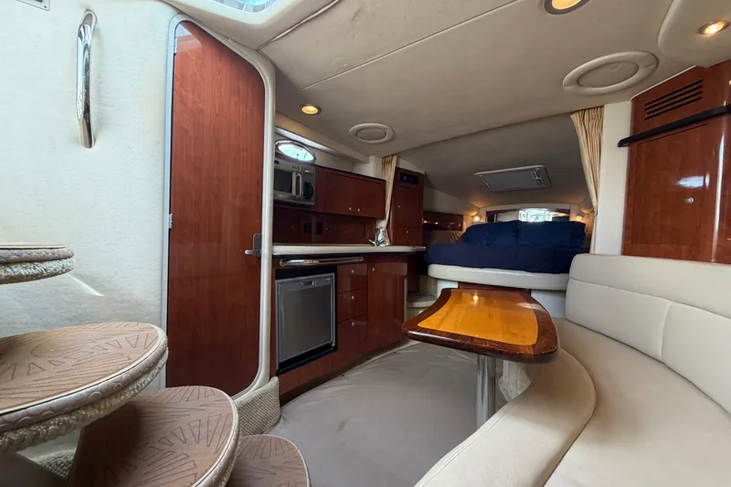 Slide: The Image of Luxurious interior of 2006 Sea Ray Sundancer 320 yacht with kitchen and seating area. - 88