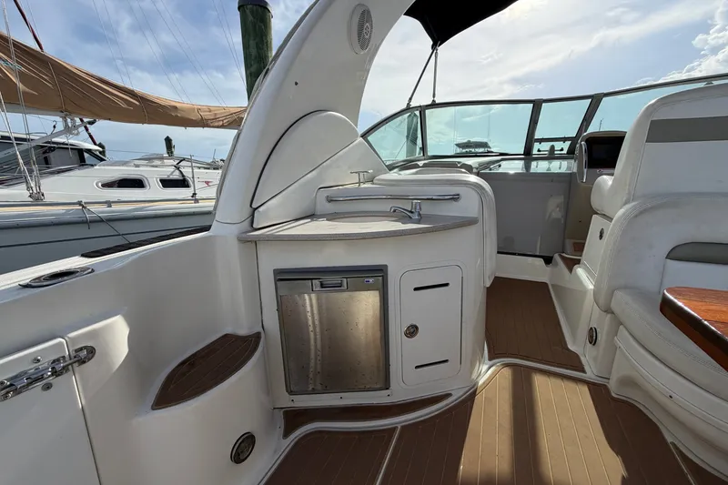 Slide: The Image of Interior of 2006 Sea Ray Sundancer 320 yacht with kitchenette and seating area. - 36
