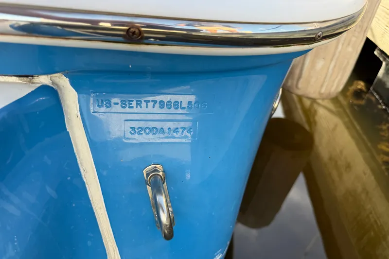 Slide: The Image of Close-up of a 2006 Sea Ray Sundancer 320 boat hull with serial number visible. - 102