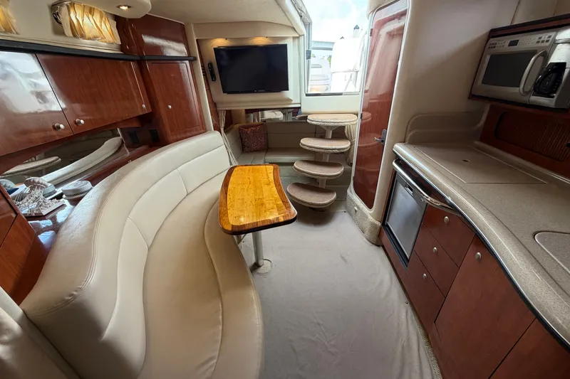 Slide: The Image of Interior of 2006 Sea Ray Sundancer 320 yacht with elegant seating and modern amenities. - 76