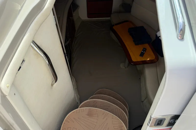 Slide: The Image of Interior cabin of 2006 Sea Ray Sundancer 320 with seating and table. - 68