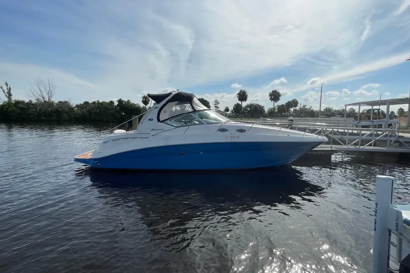 Slide: The Image of 2006 Sea Ray Sundancer 320 yacht docked on a sunny day. - 1