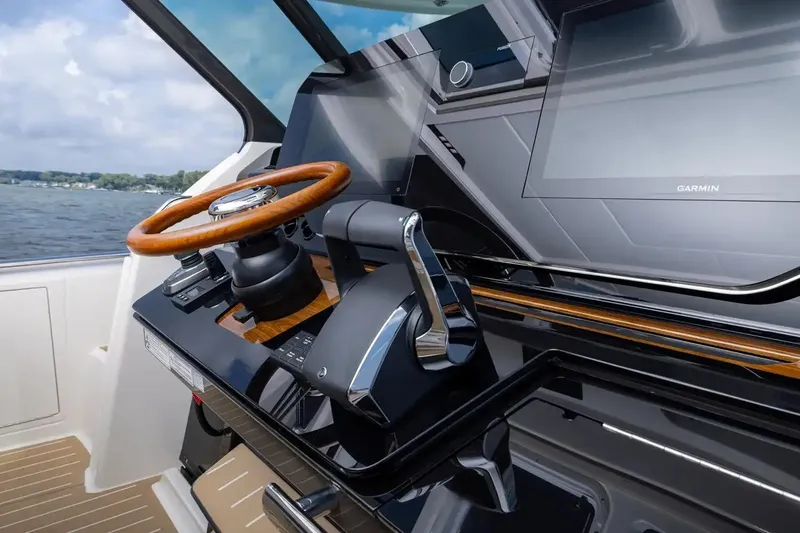Slide: The Image of Manufacturer Provided Image: 2026 Tiara Yachts 39 LS helm with wooden steering wheel and Garmin display. - 9