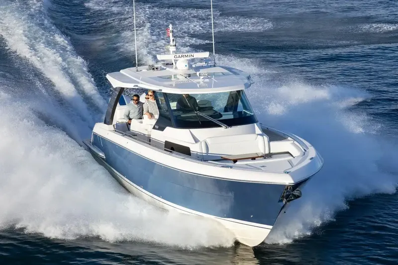 Slide: The Image of Manufacturer Provided Image: 2026 Tiara Yachts 39 LS cruising on open water, showcasing sleek design and performance. - 1