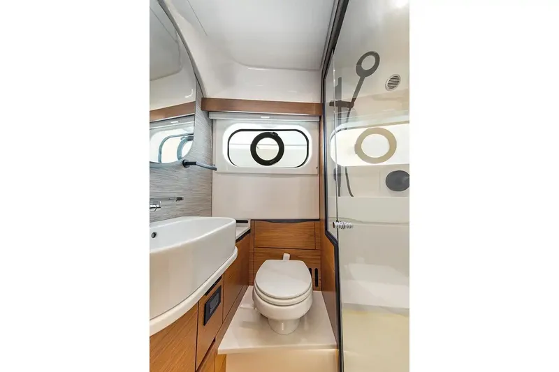 Slide: The Image of Manufacturer Provided Image: Modern bathroom interior of 2026 Tiara Yachts 39 LS, featuring sleek design and wood accents. - 13