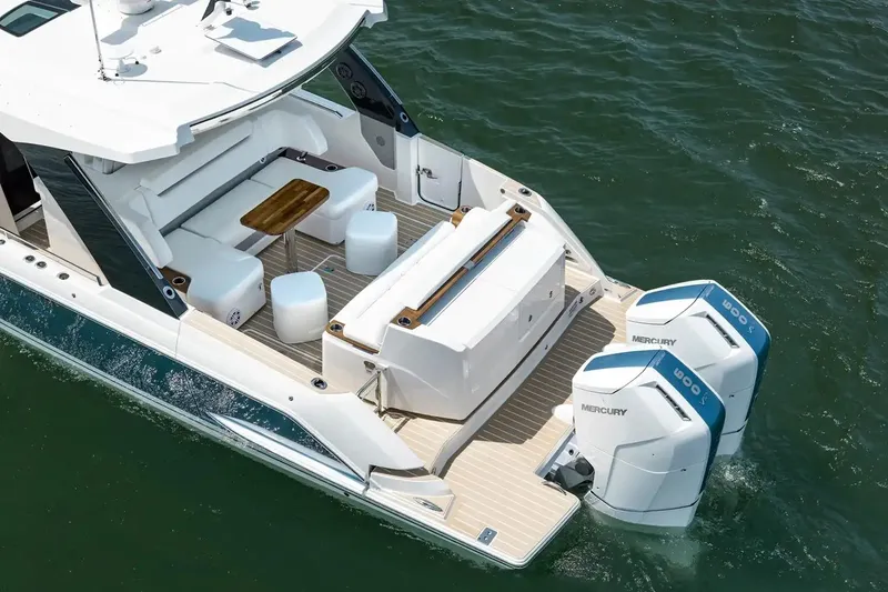 Slide: The Image of Manufacturer Provided Image: 2026 Tiara Yachts 39 LS with dual Mercury engines, elegant seating, and teak deck. - 4