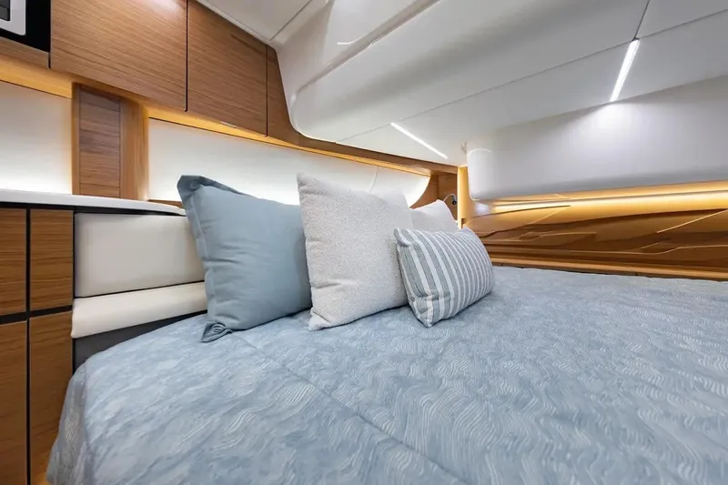 Slide: The Image of Manufacturer Provided Image: Luxurious cabin interior of 2026 Tiara Yachts 39 LS, featuring elegant bedding and modern design. - 12