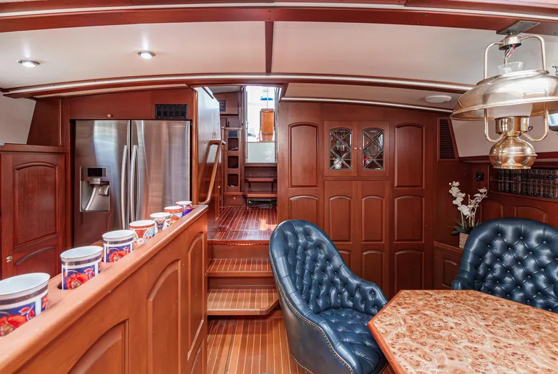 Slide: The Image of Luxurious interior of 1999 Philbrook's 69' Custom PH Sailing Sloop with wood finishes and modern amenities. - 38