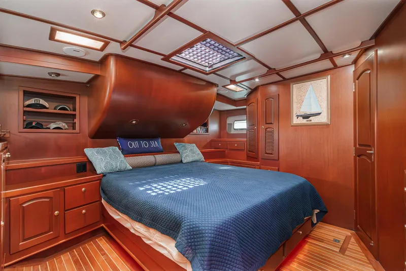 Slide: The Image of Luxurious cabin interior of 1999 Philbrook's 69' Custom PH Sailing Sloop with wooden finishes. - 47