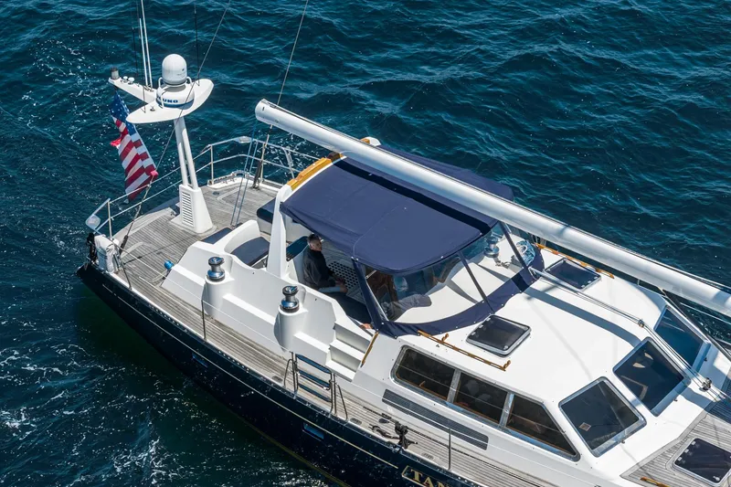 Slide: The Image of Philbrook's 69' Custom PH Sailing Sloop, 1999, cruising on open water. - 14