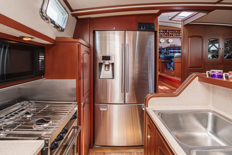 Slide: The Image of Luxurious kitchen in 1999 Philbrook's 69' Custom PH Sailing Sloop with stainless steel appliances. - 43