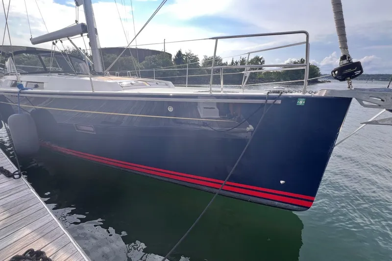 Slide: The Image of 2020 Hanse 458 sailboat docked, featuring sleek design and modern rigging. - 8