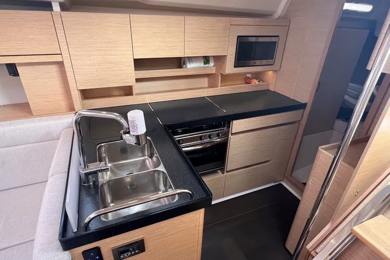 Slide: The Image of Modern kitchen interior of 2020 Hanse 458 yacht with sleek cabinetry and appliances. - 48