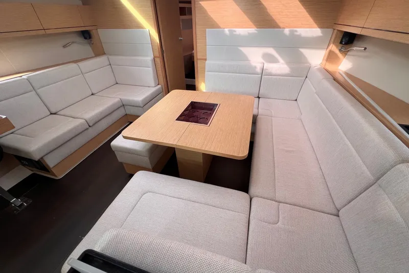 Slide: The Image of Luxurious interior of 2020 Hanse 458 yacht with elegant seating and wooden table. - 44