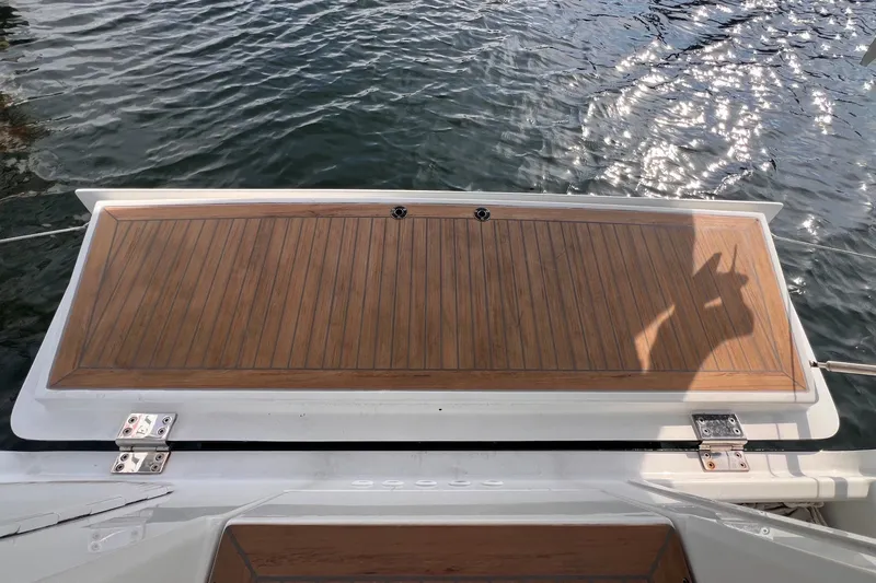 Slide: The Image of Teak deck of 2020 Hanse 458 yacht with water reflection. - 31