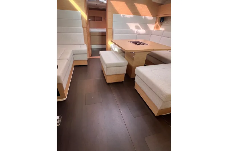 Slide: The Image of Luxurious interior of 2020 Hanse 458 yacht with modern seating and wooden finishes. - 46