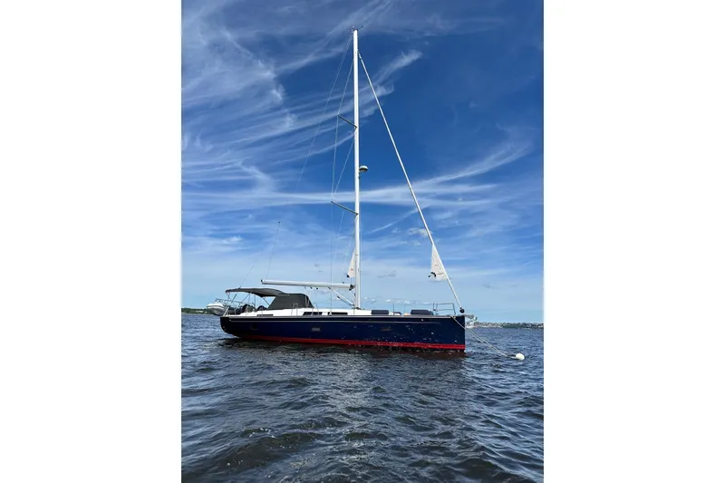 The Image of 2020 Hanse 458 sailboat on open water under a clear blue sky. - 0