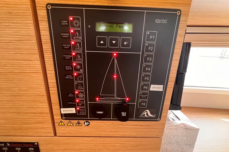 Slide: The Image of Control panel of a 2020 Hanse 458 yacht, featuring various light and system indicators. - 55