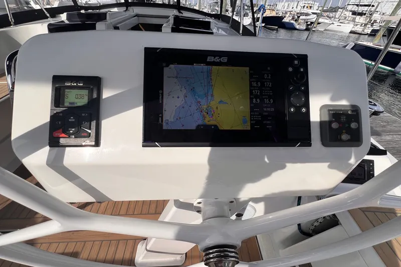 Slide: The Image of Cockpit of 2020 Hanse 458 yacht with navigation display and controls. - 26