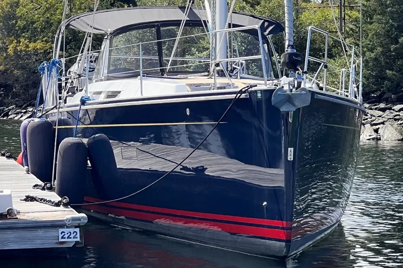 Slide: The Image of 2020 Hanse 458 yacht docked, featuring sleek design and modern amenities. - 1