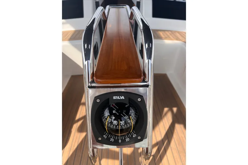 Slide: The Image of Compass on 2020 Hanse 458 yacht, featuring sleek wood and metal design. - 28