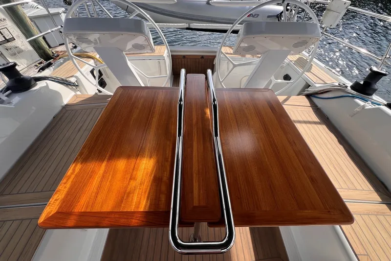 Slide: The Image of Hanse 458 yacht cockpit with wooden table and dual steering wheels, 2020 model. - 29