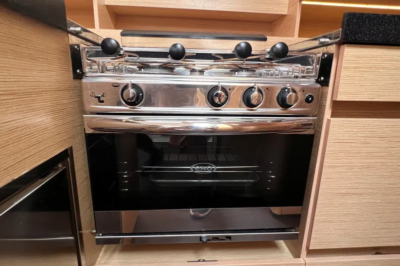 Slide: The Image of Modern stainless steel oven in a 2020 Hanse 458 yacht kitchen. - 51