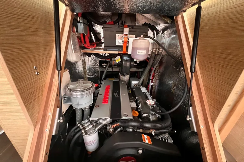 Slide: The Image of Engine compartment of a 2020 Hanse 458 yacht, featuring a Yanmar engine. - 72