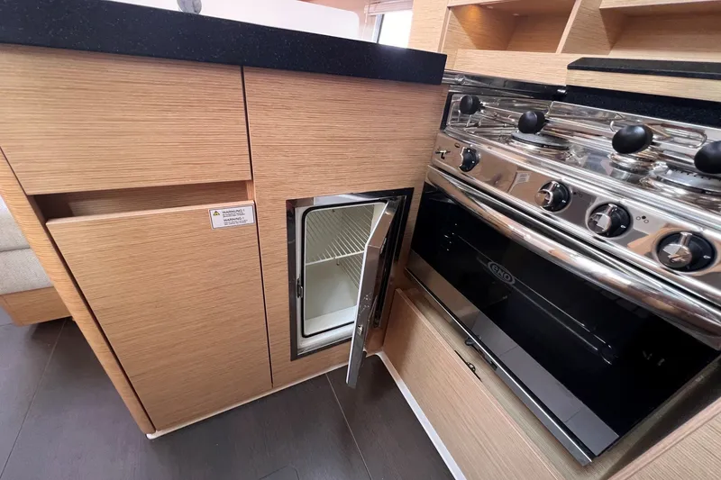 Slide: The Image of Modern kitchen in 2020 Hanse 458 yacht with stove and open fridge. - 52