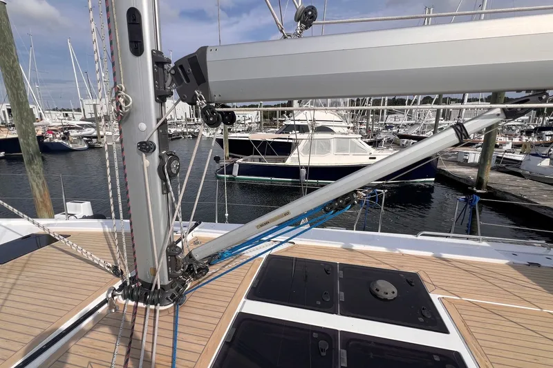 Slide: The Image of Sailboat deck view of 2020 Hanse 458, featuring mast and rigging in marina setting. - 14