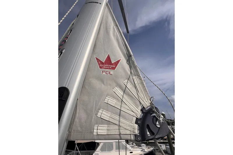Slide: The Image of Sail of a 2020 Hanse 458 yacht with Elvstrøm Sails logo against blue sky. - 15