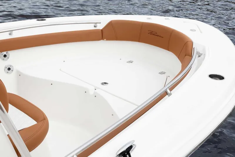Slide: The Image of Manufacturer Provided Image: 2025 Pioneer 202 Islander boat interior with tan seating and stainless steel railings. - 3