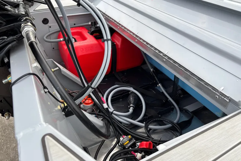 Slide: The Image of Interior view of 2027 Tracker Bass Tracker Classic CC boat showing fuel tank and wiring. - 23