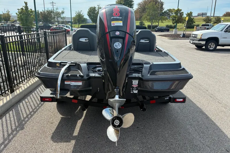 Slide: The Image of 2027 Nitro Z18 XL Pro boat with powerful outboard motor, parked in a lot. - 2