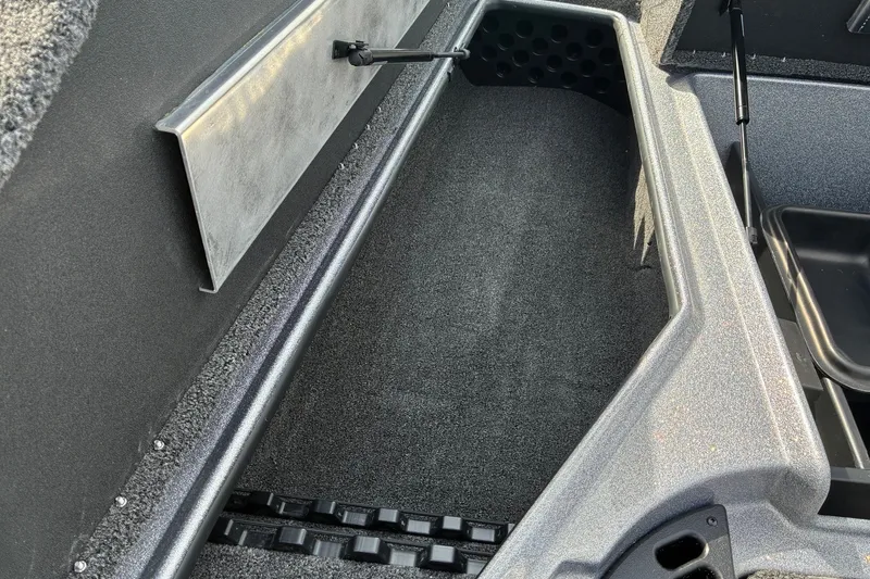 Slide: The Image of Interior storage compartment of 2027 Nitro Z18 XL Pro boat, featuring carpeted finish. - 12
