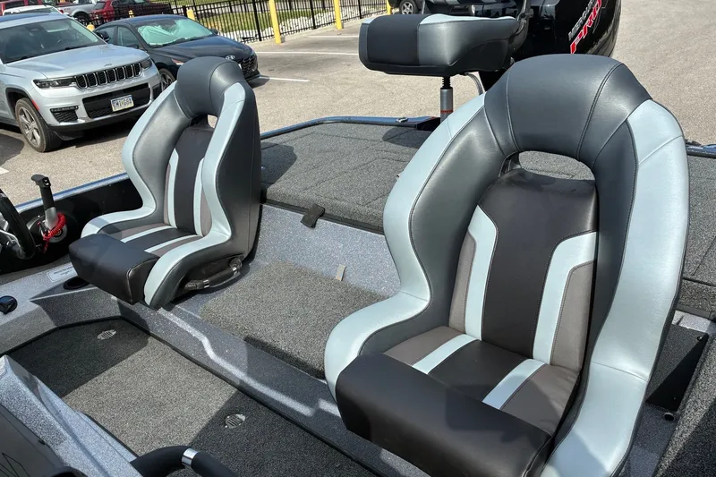 Slide: The Image of 2027 Nitro Z18 XL Pro boat seats in a parking lot setting. - 6