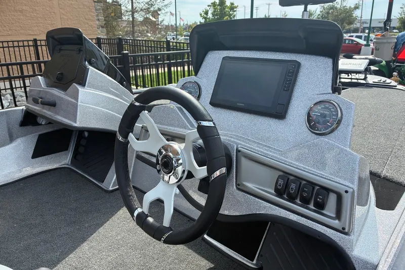 Slide: The Image of Interior view of a 2027 Nitro Z18 XL Pro boat dashboard with steering wheel and controls. - 3