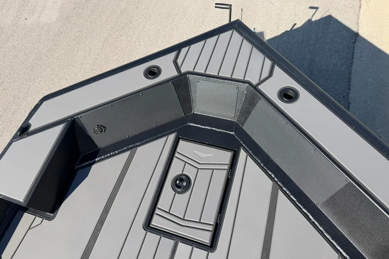 Slide: The Image of 2027 Tracker Grizzly 1756 T Marsh boat deck with storage compartments and sleek design. - 21