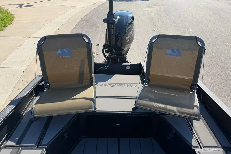 Slide: The Image of 2027 Tracker Grizzly 1756 T Marsh boat with dual seats and Mercury outboard motor. - 15