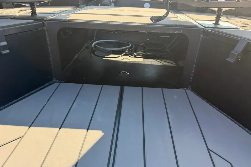 Slide: The Image of Interior view of 2027 Tracker Grizzly 1756 T Marsh boat storage compartment. - 17
