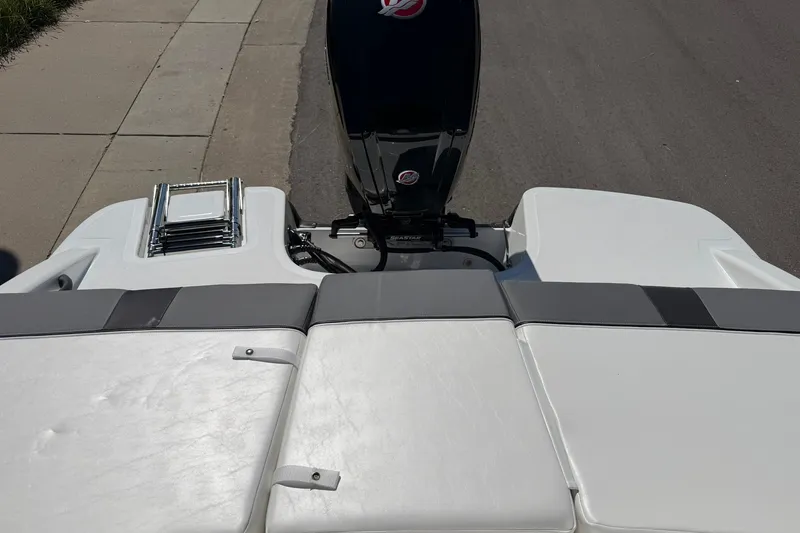 Slide: The Image of 2027 Tahoe T18 boat with outboard motor and swim platform ladder. - 20