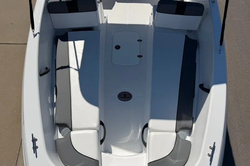 Slide: The Image of 2027 Tahoe T18 boat interior with sleek seating and storage compartments. - 82
