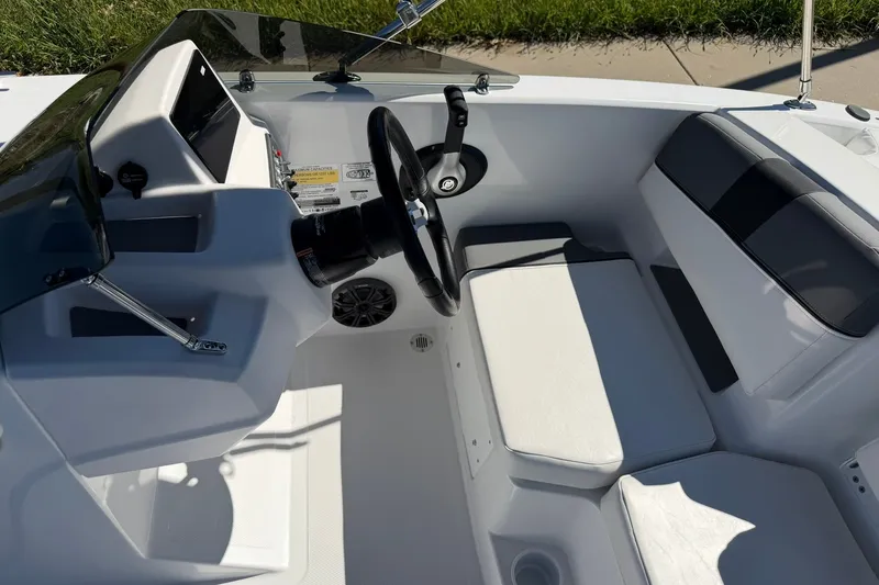Slide: The Image of Interior view of 2027 Tahoe T18 boat cockpit with steering wheel and seating. - 13