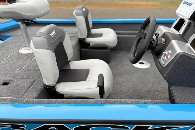 Slide: The Image of 2027 Tracker Pro Team 175 Crappie Edition boat interior with gray seats and steering console. - 28